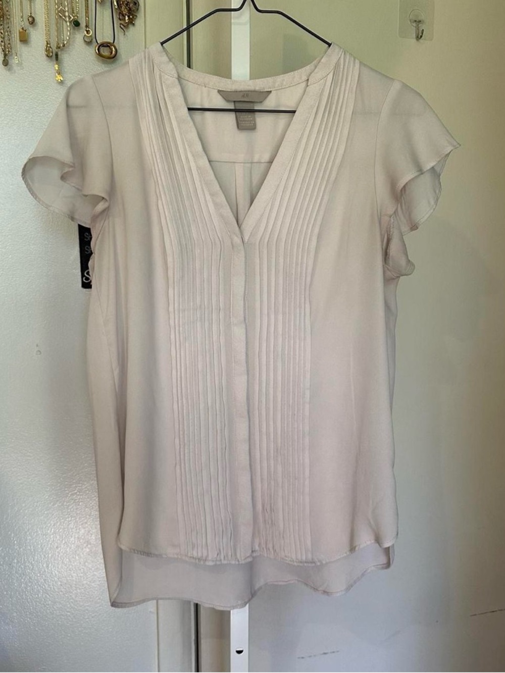 H&M Cream blouse with ruffled sleeves